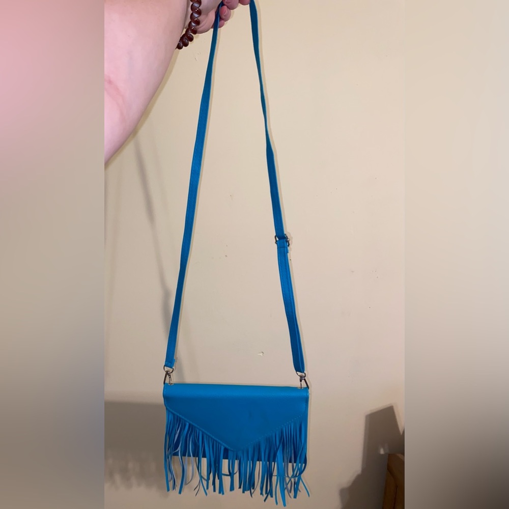 blue purse with fringe